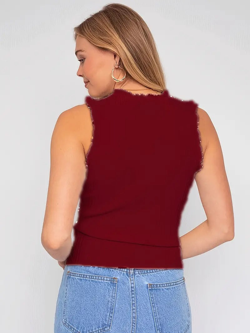 Evania – Elegante top con volantes y brillo