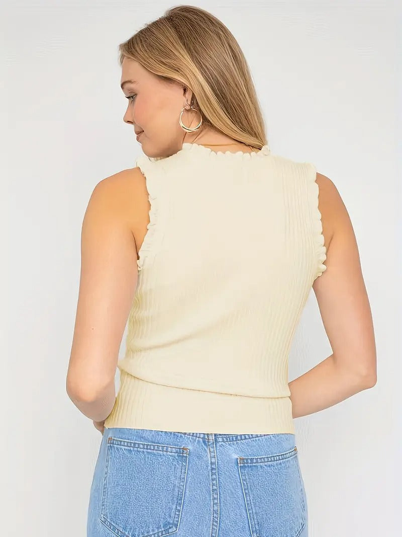 Evania – Elegante top con volantes y brillo